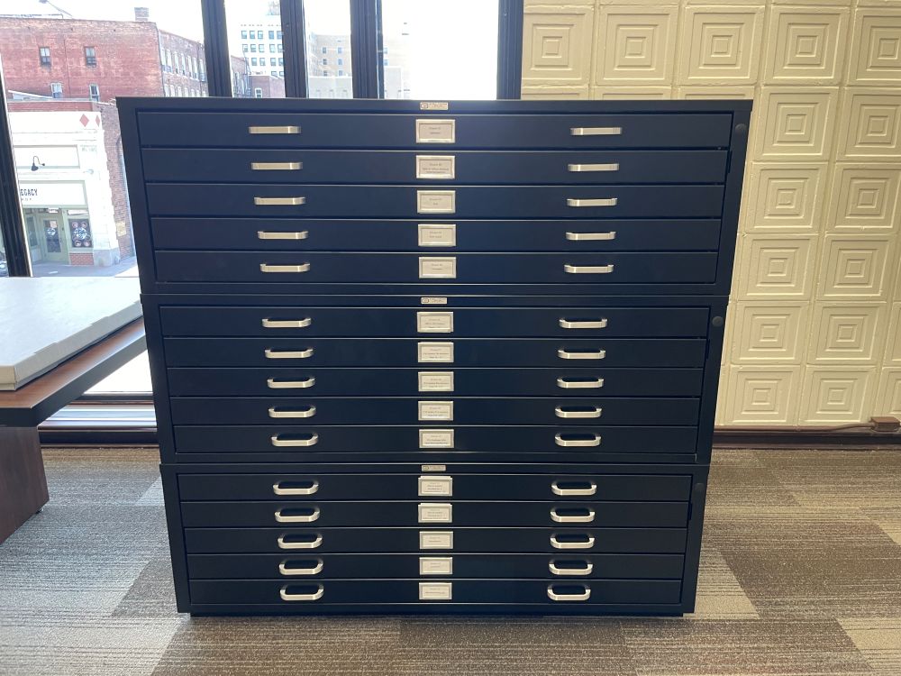 Image of a 15 drawer black metal map case located in Special Collections.